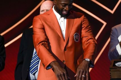 Hot officer pushed Wade wearing a Hall of Fame jacket photo: This orange jacket fits too well